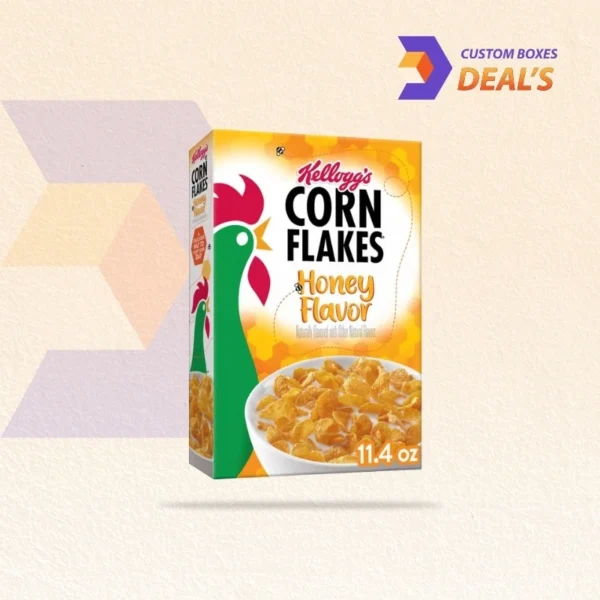 corn flakes cereal box next to bowl setup
