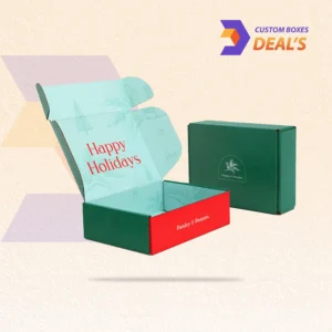 Holiday mailer boxes with festive designs for seasonal product shipping.